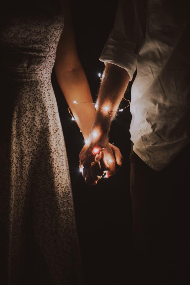 holding hands with lights