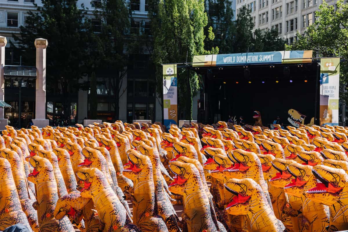 group of people in dinosaur costumes