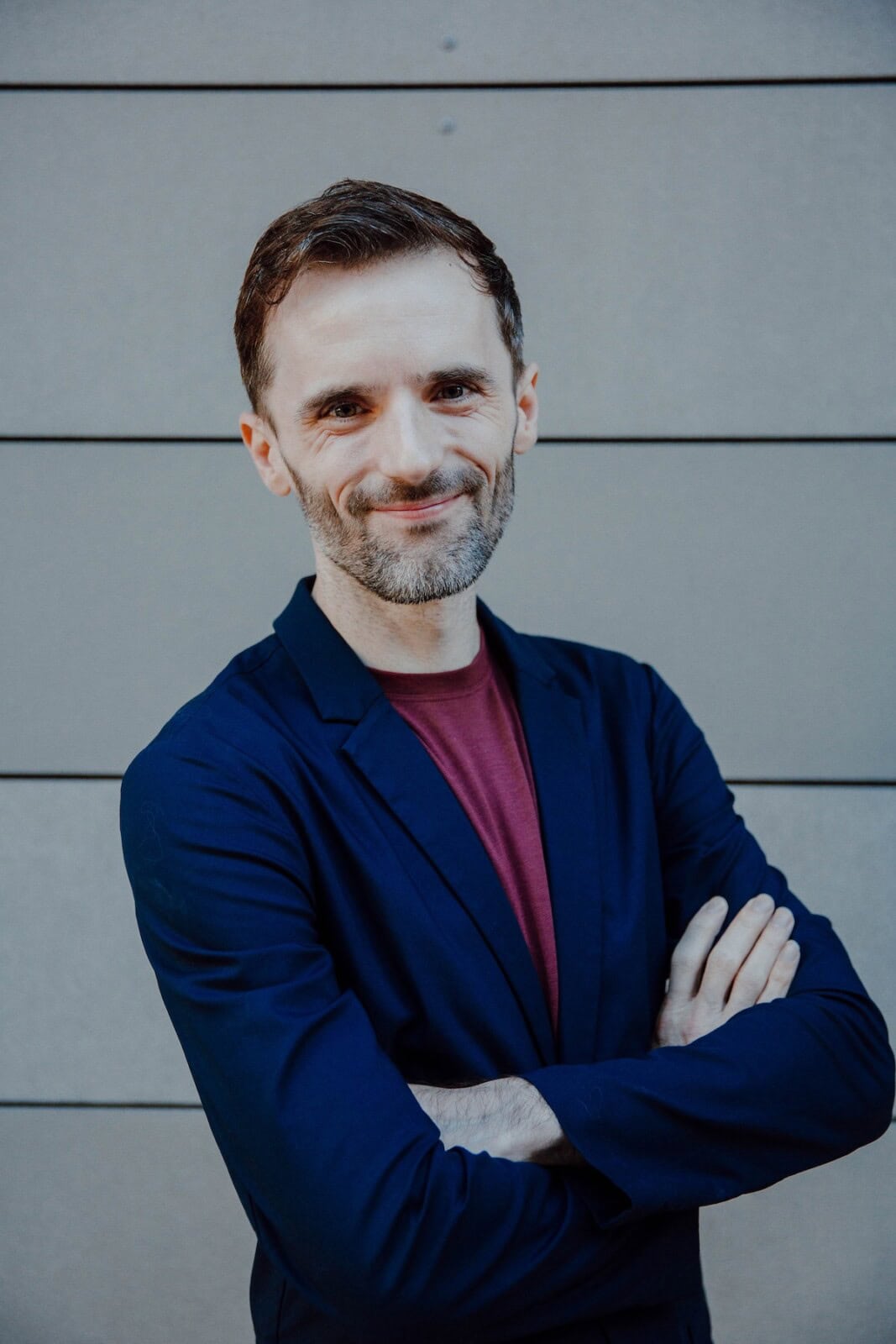 michael standing with arms crossed